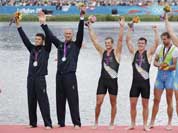 Italy`s Romano Battisti and Alessio Sartori , New Zealand`s Joseph Sullivan and Nathan Cohen and Slovenia`s Iztok Cop and Luka Spik and Iztok Cop celebrate with the medals they won for the men`s rowing double sculls in Eton Dorney, near Windsor, England.