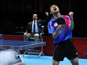 Chuang Chih-yuan of Taiwan, reacts against Dimitrij Ovtcharov of Germany, during the bronze medal match at men`s singles table tennis at the 2012 Summer Olympics.