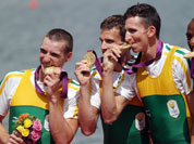 South Africa`s Sizwe Ndlovu, John Smith, Mathew Brittain and James Thompson kiss the gold medals they won for the lightweight men`s rowing four in Eton Dorney, near Windsor, England, at the 2012 Summer Olympics.