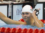Denmark`s Lotte Friis gestures after competing in a women`s 800-meter freestyle swimming heat at the Aquatics Centre in the Olympic Park during the 2012 Summer Olympics in London.