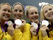 Australia`s women`s 4 X 200-meter freestyle relay team from left, Kylie Palmer, Alicia Coutts, Bronte Barratt, and Melanie Schlanger pose with their silver medals at the Aquatics Centre in the Olympic Park during the 2012 Summer Olympics.