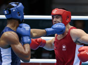 Canada`s Simon Kean, right, fights France`s Tony Yoka, during their men`s super heavyweight over 91-kg boxing match at the 2012 Summer Olympics, in London. 