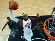 Lebron James of the United States (6) shoots against Tony Skinn (4) and Al-Farouq Aminu (7) of Nigeria during their men`s basketball preliminary round match at the 2012 Summer Olympics.