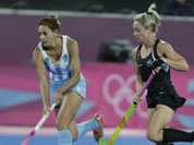 Argentina`s captain Luciana Aymar runs with the ball during a women`s hockey preliminary round match against New Zealand, at the 2012 Summer Olympics.