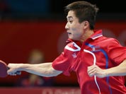 Kim Hyok Bong of North Korea competes against Ryu Seungmin of South Korea during men`s team table tennis competition at the 2012 Summer Olympics.