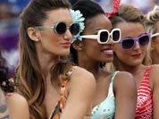 Dancing perform during a beach volleyball match at the 2012 Summer Olympics.