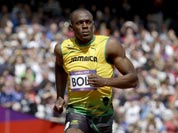 Nigeria`s Ogho-Oghene Egwero, left, Jamaica`s Usain Bolt, center, and Britain`s James Dasaolu compete in a men`s 100-meter heat during the athletics in the Olympic Stadium at the 2012 Summer Olympics.
