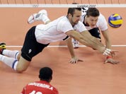 Germany`s Gyorgy Grozer (9, left) and Lukas Kampa (11) dive for a shot by Tunisia`s Anouer Taouerghi (12) during a men`s volleyball preliminary match at the 2012 Summer Olympics.
