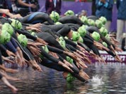 New Zealand`s Nicky Samuels dives into the water for the start of the triathlon at the 2012 Summer Olympics.