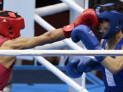 India`s Devendro Singh Laishram, left, and Mongolia`s Serdamba Pureverdorj, fight during the men`s light flyweight boxing competition at the 2012 Summer Olympics.