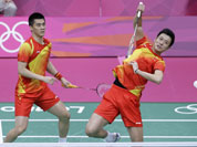 China`s Cai Yun, and Fu Haifeng play against Malaysia`s Koo Kien Keat and Tan Boon Heong, unseen, at a men`s doubles badminton semifinal match of the 2012 Summer Olympics in London. 