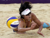 Zhang Xi of China dives for the ball during a beach volleyball match against Russia at the 2012 Summer Olympics in London. 