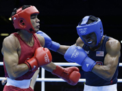 India`s Krishan Vikas, left, fights United States` Errol Spence during a men`s welterweight 69-kg preliminary boxing match at the 2012 Summer Olympics.