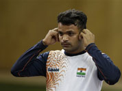 dia`s Vijay Kumar removes his ear plugs at the end of the men`s 25-meter rapid fire pistol final at the 2012 Summer Olympics, Friday, Aug. 3, 2012, in London. Kumar finished second to win the silver.