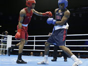 India`s Krishan Vikas, left, fights United States` Errol Spence during a men`s welterweight 69-kg preliminary boxing match at the 2012 Summer Olympics.