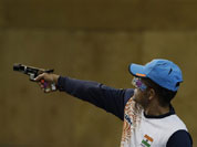 India`s Vijay Kumar shoots during the men`s 25-meter rapid fire pistol final at the 2012 Summer Olympics, Friday, Aug. 3, 2012, in London. Kumar finished second to win the silver.