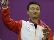 China`s Wang Zhiwei reacts after receiving the bronze medal for the men`s 50-meter pistol, at the 2012 Summer Olympics.