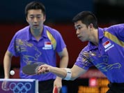 Singapore`s Jian Zhan, right, and Zi Yang compete against a team from China in the men`s team quarterfinals table tennis match at the 2012 Summer Olympics.