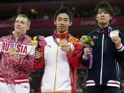 Russian bronze medallist Denis Ablyazin, left, Chinese gold medallist Zou Kai, center, and Japanese silver medallist Kohei Uchimura display their medals during the podium ceremony for the men`s floor exercise finals at the 2012 Summer Olympics.