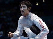 Ryo Miyake of Japan reacts during his match against Ma Jianfei of China in the men`s foil team fencing competition at the 2012 Summer Olympics.