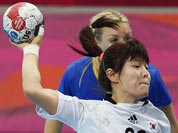South Korea`s Jung Ji-hae shoots in front of Sweden`s Isabelle Gullden, during their women`s handball preliminary match at the 2012 Summer Olympics.