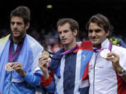 From right, silver medalist Switzerland`s Roger Federer, gold medalist Andy Murray of Great Britain, and bronze medalist Juan Martin del Potro of Argentina pose after the medal ceremony of the men`s singles event at the All England Lawn Tennis Club at Wimbledon, in London, at the 2012 Summer Olympic