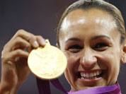 Britain`s Jessica Ennis poses with her gold medal for the heptathlon during the athletics in the Olympic Stadium at the 2012 Summer Olympics.