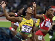 Gold medal winner, Jamaica`s Shelly-Ann Fraser-Pryce, left, crosses the finish line ahead of silver medal winner United States` Carmelita Jeter during the women`s 100-meter final during athletics competition in the Olympic Stadium at the 2012 Summer Olympics.