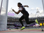 India`s Krishna Poonia competes in the women`s discus throw during athletics competition in the Olympic Stadium at the 2012 Summer Olympics.