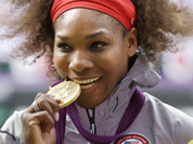 Gold medalist United States` Serena Williams pose during the podium ceremony of the women`s singles final match at the All England Lawn Tennis Club at Wimbledon, in London, at the 2012 Summer Olympics