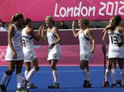 New Zealand players celebrate after qualifying for semifinals following a scoreless women`s hockey match against Germany at the 2012 Summer Olympics.