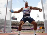 Britain`s Lawrence Okoye takes a throw in a men`s discus throw qualification round during the athletics in the Olympic Stadium at the 2012 Summer Olympics.