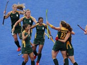 South Africa players celebrate a goal against the United States during their preliminary round women`s hockey match at the 2012 Summer Olympics.