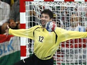 Serbia`s Darko Stanic, right, fails to save a shot by Hungary`s Tamas Mocsai, left, during their men`s handball preliminary match at the 2012 Summer Olympics.