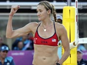 Kerri Walsh Jennings of the United States reacts after blocking the shot of Italy`s Marta Menegatti, right, during a beach volleyball match at the 2012 Summer Olympics.