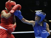Chungneijang Mery Kom Hmangte, right, fights Tunisia`s Maroua Rahali during a women`s flyweight 51-kg quarterfinal boxing match at the 2012 Summer Olympics.
