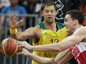 Russia`s Sasha Kaun, right, passes as he is pressured by Australia`s David Andersen during a men`s basketball game at the 2012 Summer Olympics.