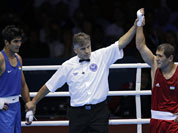 Uzbekistan`s Abbos Atoev, right, defeats India`s Vijender Singh in a middleweight 75-kg quarterfinal boxing match at the 2012 Summer Olympics.