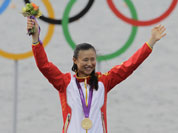 Xu Lijia of China celebrates her gold medal after the Laser radial sailing race at the London 2012 Summer Olympics.