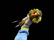 Gold medalist Oleksiy Torokhtiy of Ukraine, holds up the flowers during the awards presentation after the men`s 105-kg weightlifting competition at the 2012 Summer Olympics