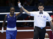 Great Britain`s Nicola Adams, and India`s Chungneijang Mery Kom Hmangte react following a women`s flyweight 51-kg semifinal boxing match at the 2012 Summer Olympics in London. 