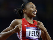 United States` Allyson Felix celebrates her win in the women`s 200-meter final during the athletics in the Olympic Stadium at the 2012 Summer Olympics.