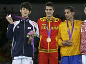 Gold medalist Spain`s Joel Gonzalez Bonilla,  stands on the podium with silver medalist South Korea`s Lee Dae-hoon, bronze medalist Colombia`s Oscar Munoz Oviedo and bronze medalist Russia`s Alexey Denisenko, during the medal ceremony for the men`s 58-kg taekwondo competition.