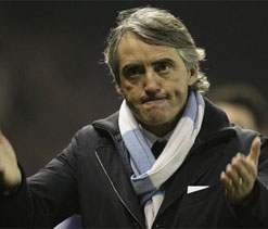 Mancini tells Wenger to ‘stop moaning about City`s wealth’