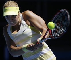 Caroline Wozniacki fights back to beat Lisicki