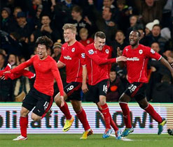 Last-gasp Kim holds Manchester United in Cardiff