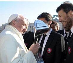 Football-mad Pope Francis greets his winning team