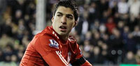 Luis Suarez puts Liverpool on top as Manchester City hit four