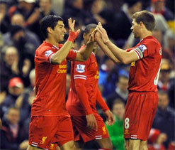 Suarez fires Liverpool as Arsenal, Chelsea, City win