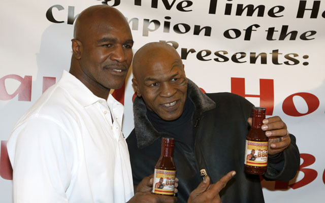 Mike Tyson and Evander Holyfield smoke peace pipe